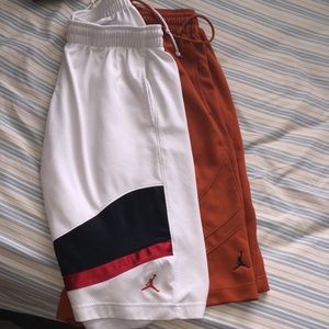2 pairs of Jordan shorts size LG orange and white